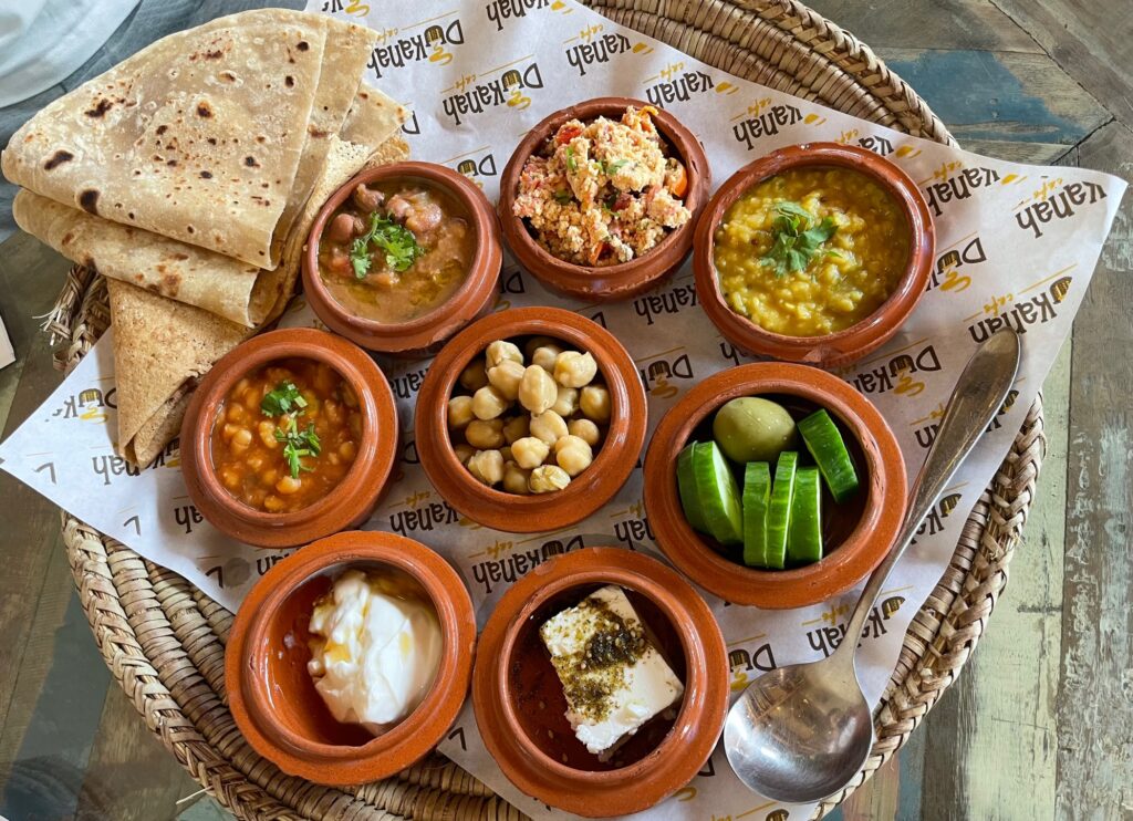 Arabic breakfast includes Ful, beans, eggs, and Labneh