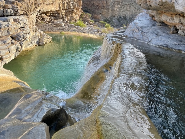 Top view on water flows into the wadi pool.