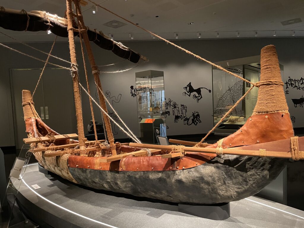 A replica of a boat is on display in the maritime exhibit room