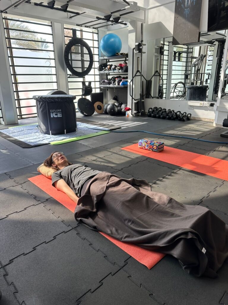 Erin laying on the floor doing breathing exercises